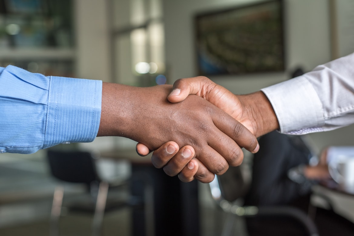 Professional handshake representing agreement